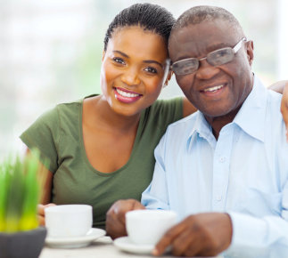 Caregiver and senior man smiling